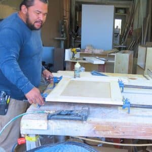 Custom cabinet being built in workshop with professional tools and materials