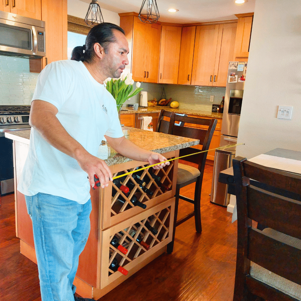 George measuring for wall removal to expand the kitchen in Lakewood, CA.