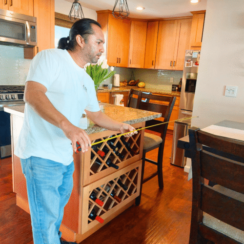 George measuring for wall removal to expand the kitchen in Lakewood, CA.