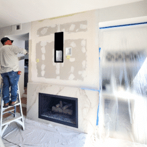 GR Repair & Maintenance team member working on drywall patching inside a home remodel